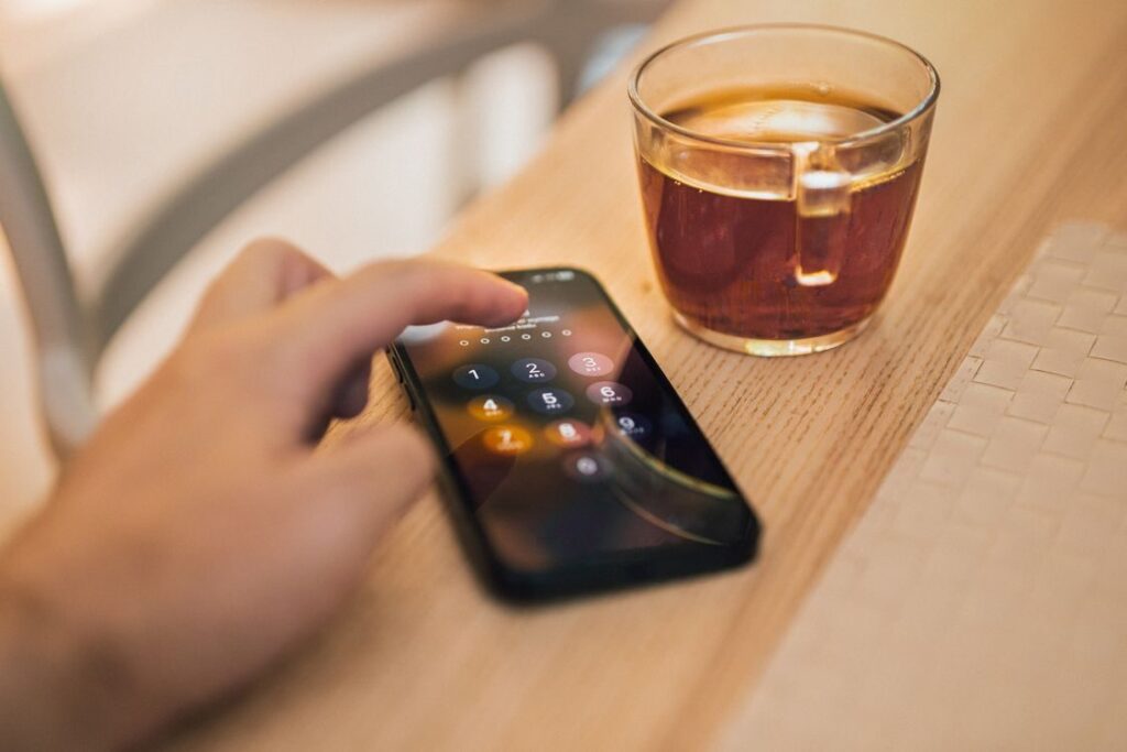 Smartphone displaying account verification steps required to access restricted digital content.