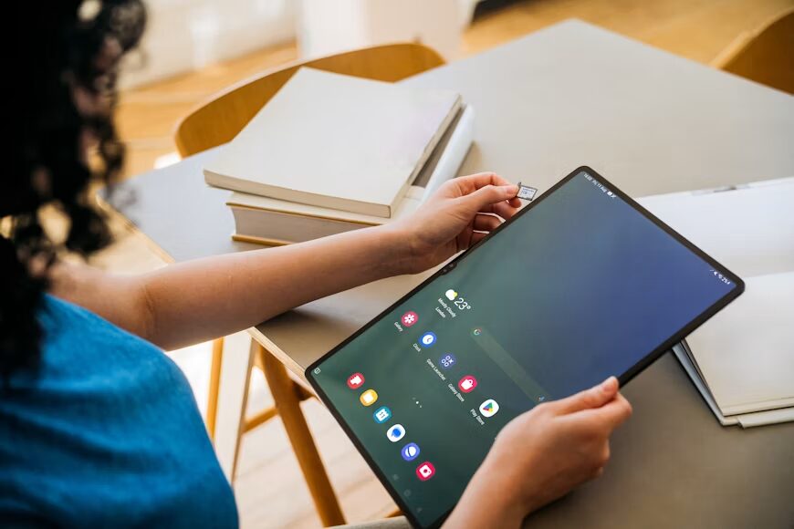 Person reading a digital comic while reviewing the author's official update.